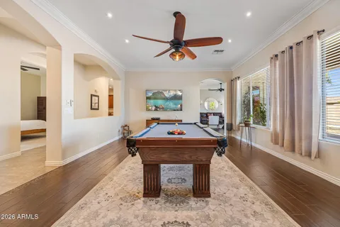 a living room with a piano and a table