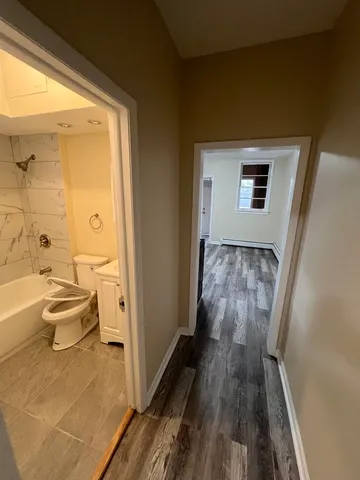 a view of bathroom with bathtub and shower