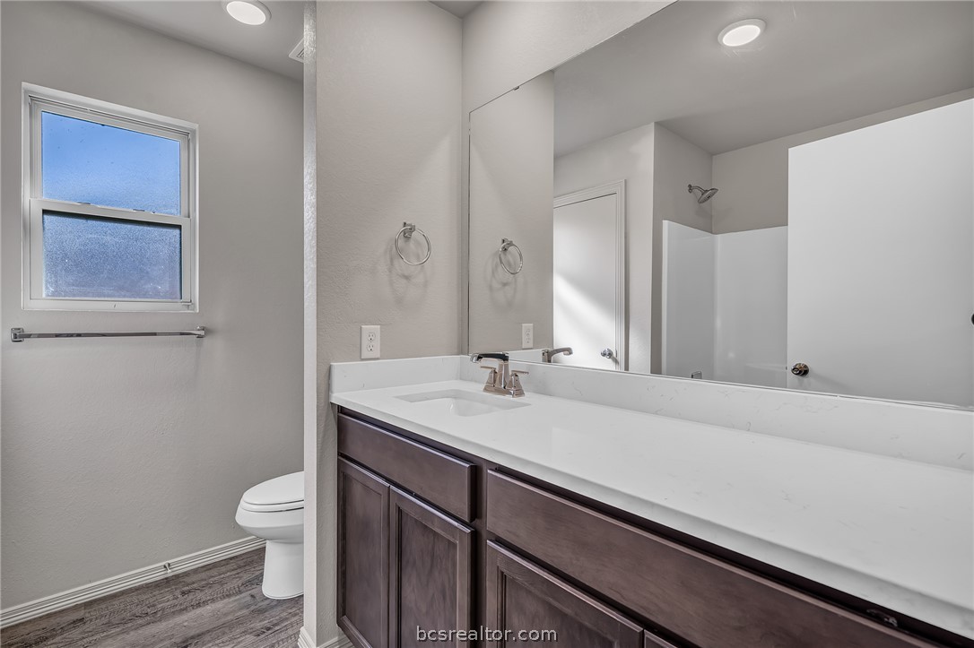 1635 Lucky Street Bryan, TX 77803 - Photo 9 of 11 a bathroom with a sink and a toilet