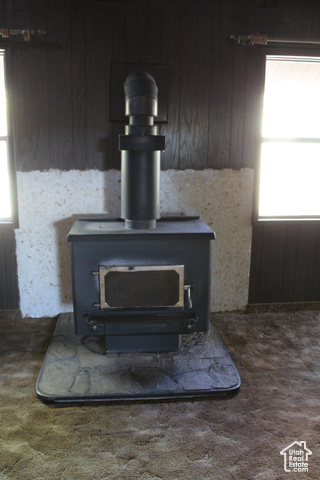 4709 East Independence Road Myton, UT 84052 - Photo 19 of 27 Detailed view of a wood stove and carpet