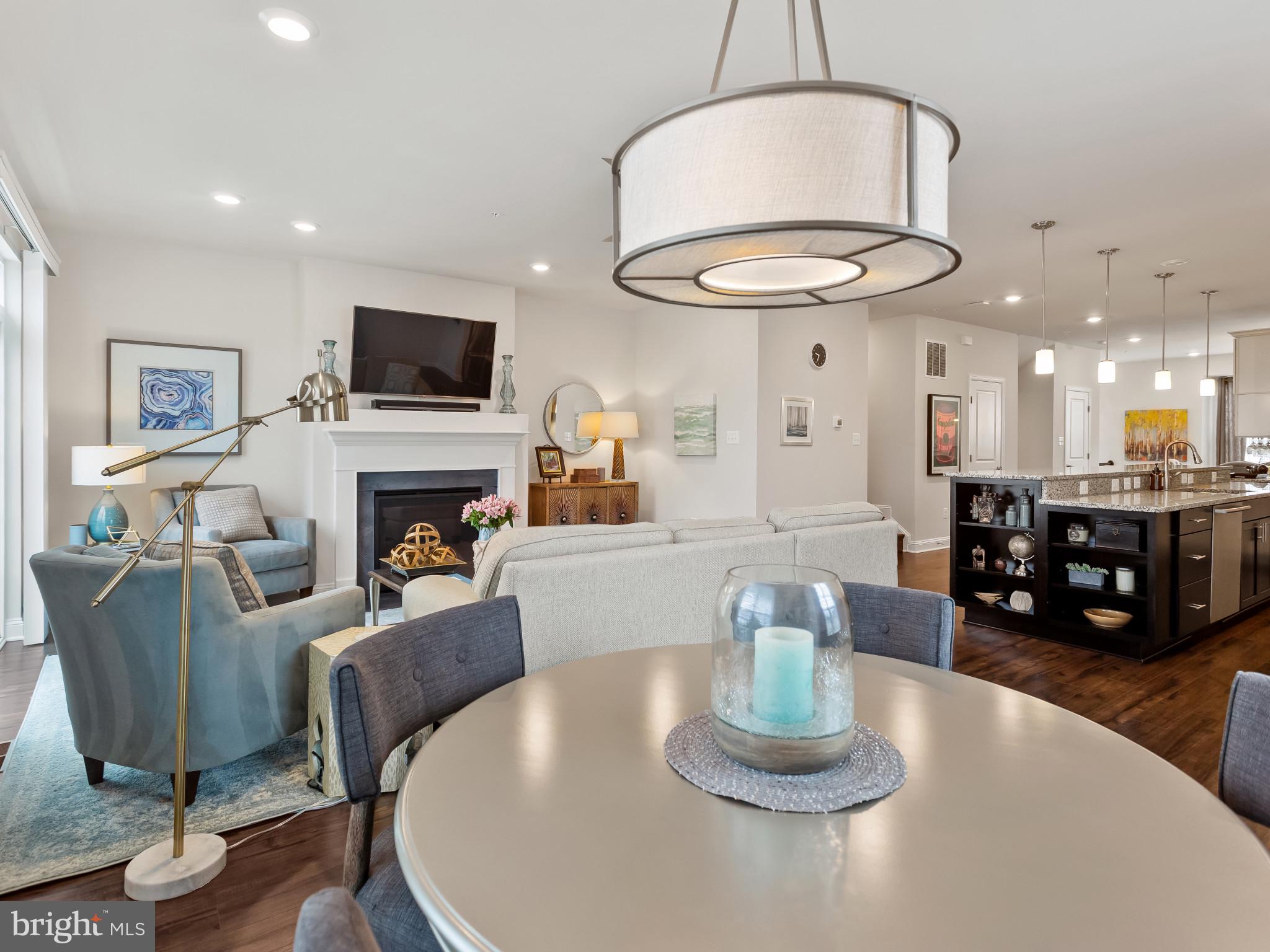 2762 Lady Slipper Road Gambrills, MD 21054 - Photo 11 of 43 a living room with furniture a mirror and a fireplace
