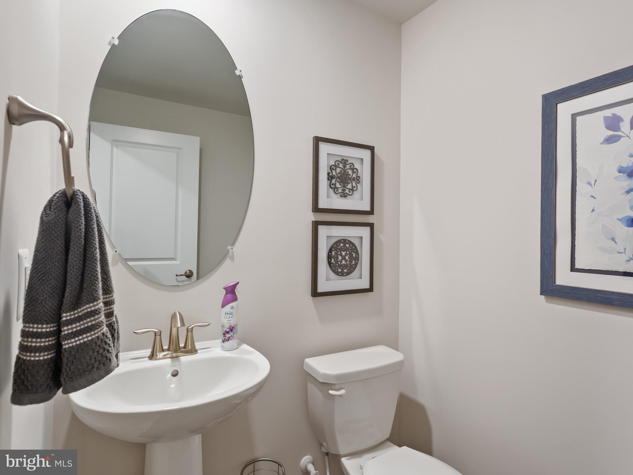 2762 Lady Slipper Road Gambrills, MD 21054 - Photo 14 of 43 a bathroom with a toilet sink and mirror