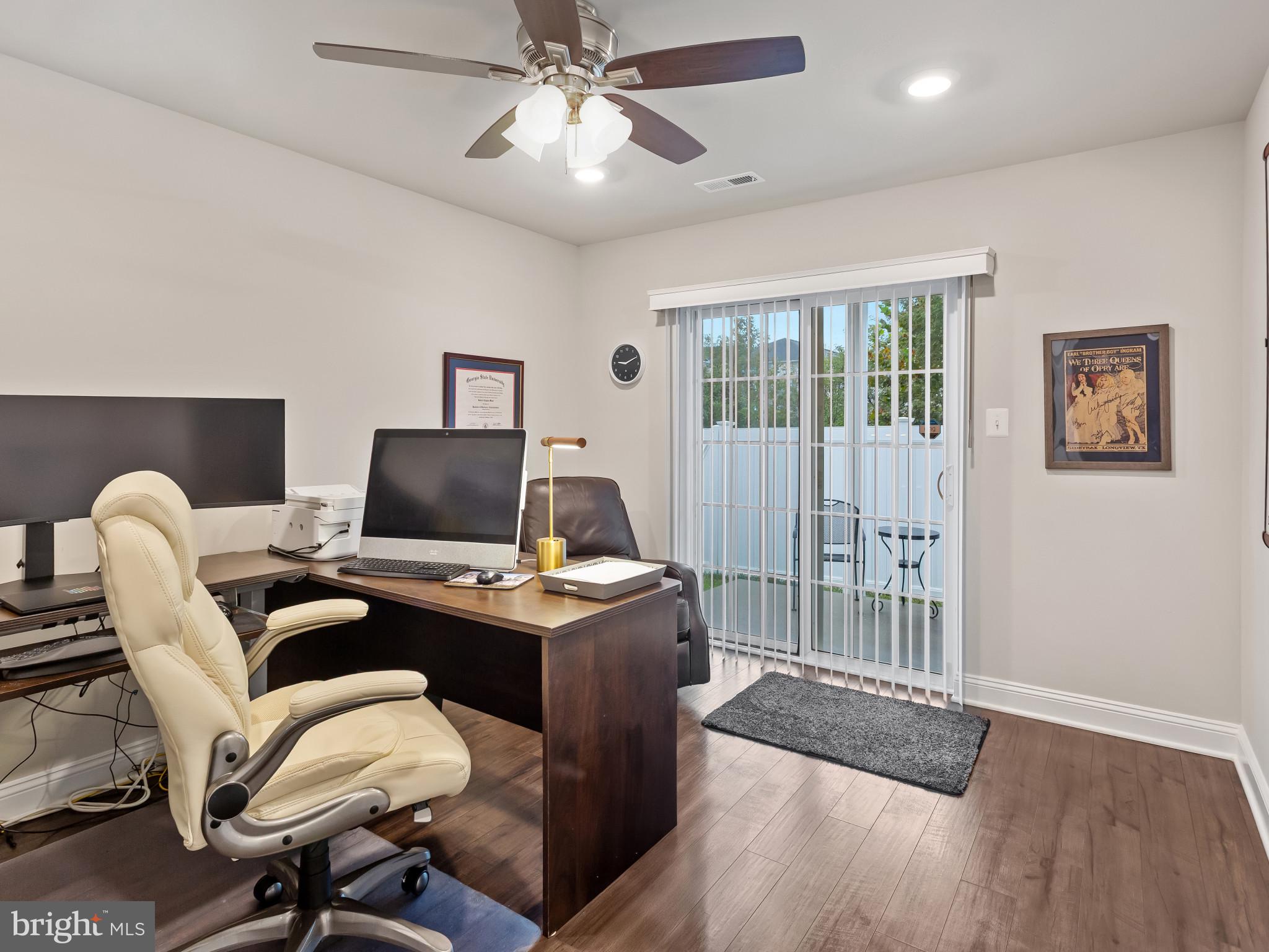 2762 Lady Slipper Road Gambrills, MD 21054 - Photo 32 of 43 a view of a workspace with furniture and a window