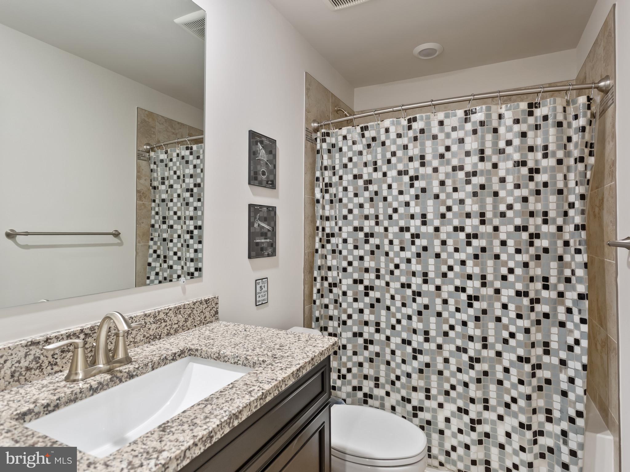 2762 Lady Slipper Road Gambrills, MD 21054 - Photo 34 of 43 a bathroom with a granite countertop sink and a mirror