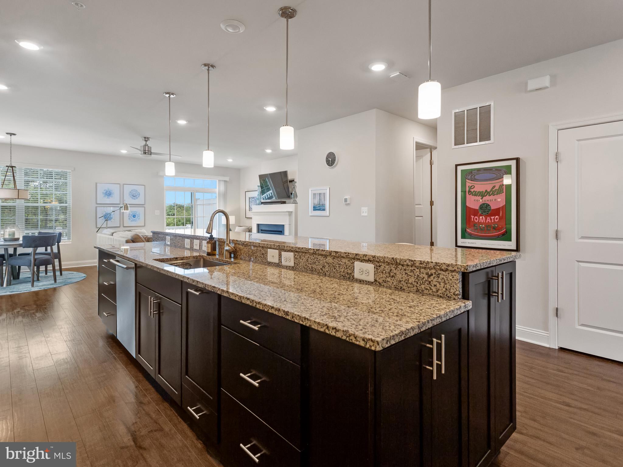 2762 Lady Slipper Road Gambrills, MD 21054 - Photo 5 of 43 a kitchen with stainless steel appliances granite countertop a kitchen island a stove and a sink