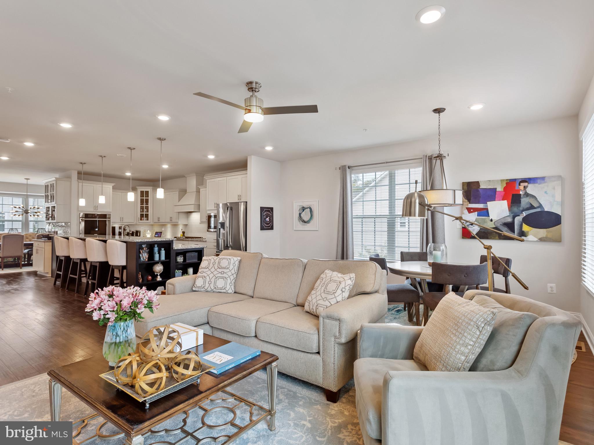 2762 Lady Slipper Road Gambrills, MD 21054 - Photo 10 of 43 a living room with furniture kitchen view and a chandelier