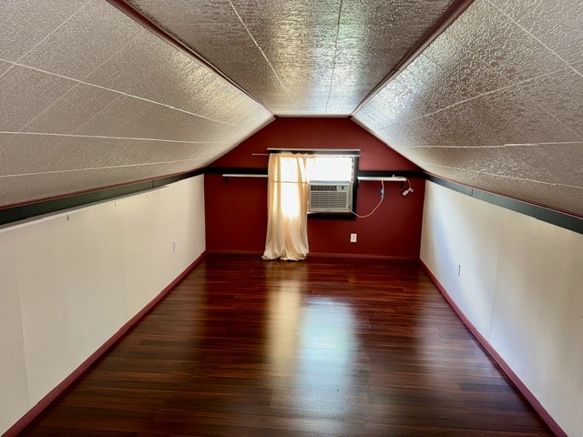 1701 West Jefferson Street Springfield, OH 45506 - Photo 15 of 18 This cozy attic space features rich hardwood flooring and a functional window unit.