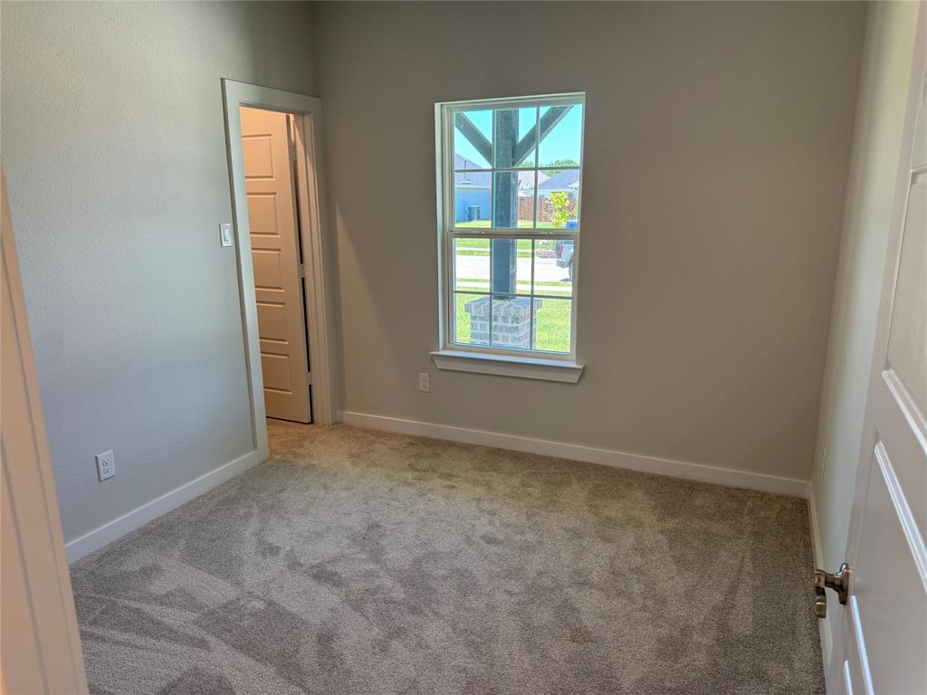 605 Finlee Way Tioga, TX 76271 - Photo 3 of 22 an empty room with windows