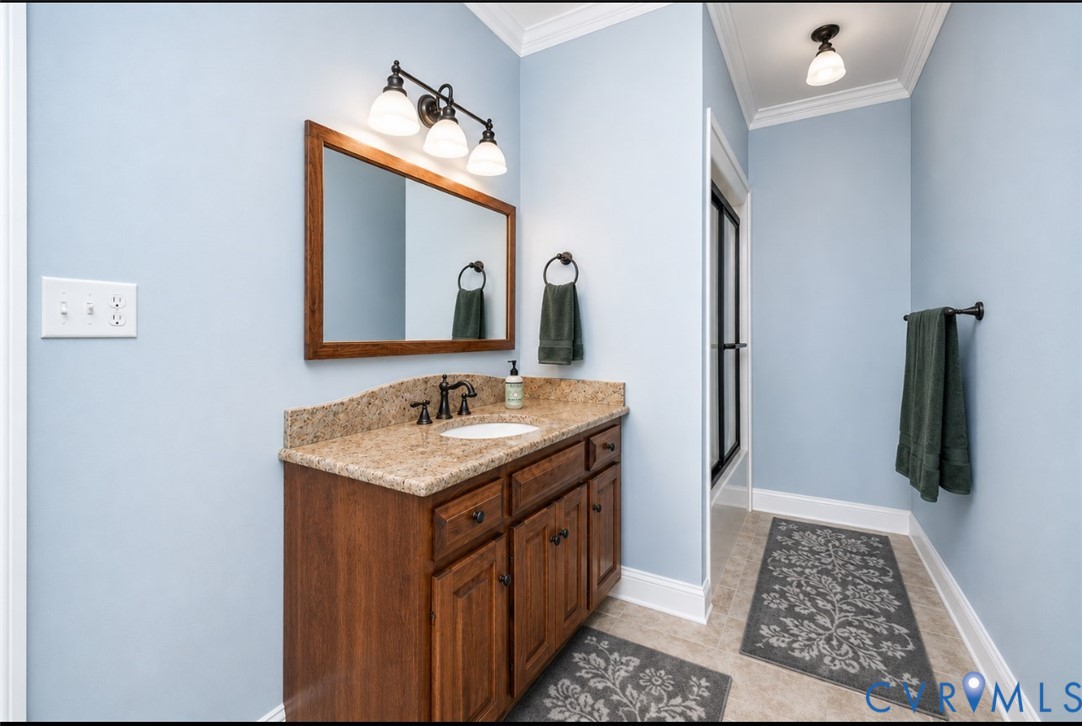 239 Jennings Road Cartersville, VA 23027 - Photo 16 of 26 Bathroom featuring a wood vanity with a stone coun