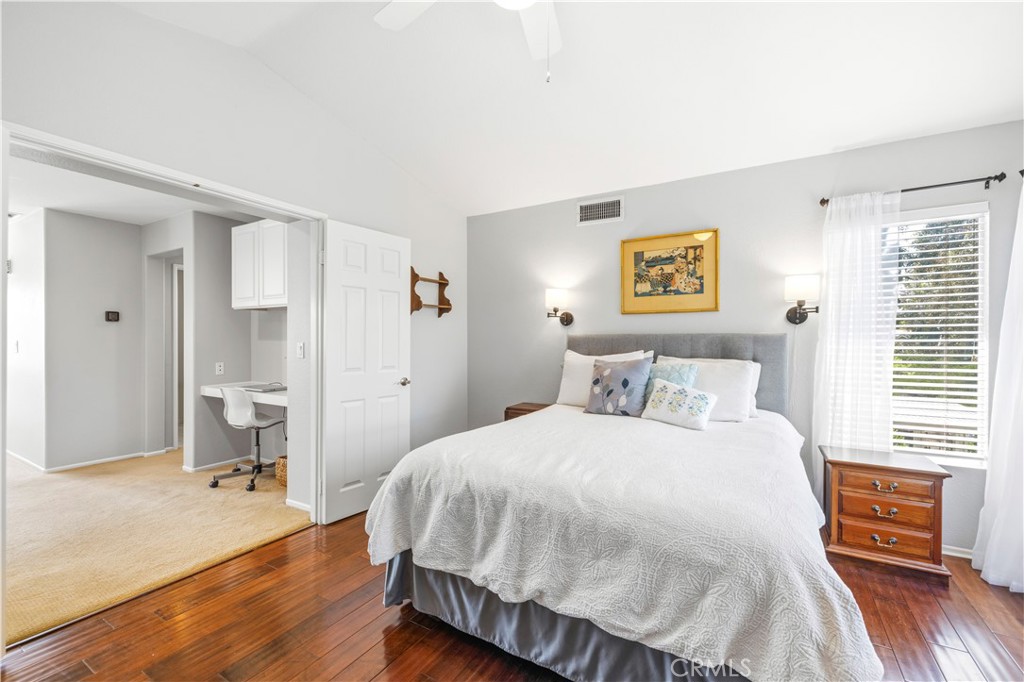 28033 Memory Lane Valencia, CA 91354 - Photo 27 of 40 a bedroom with a bed and wooden floor