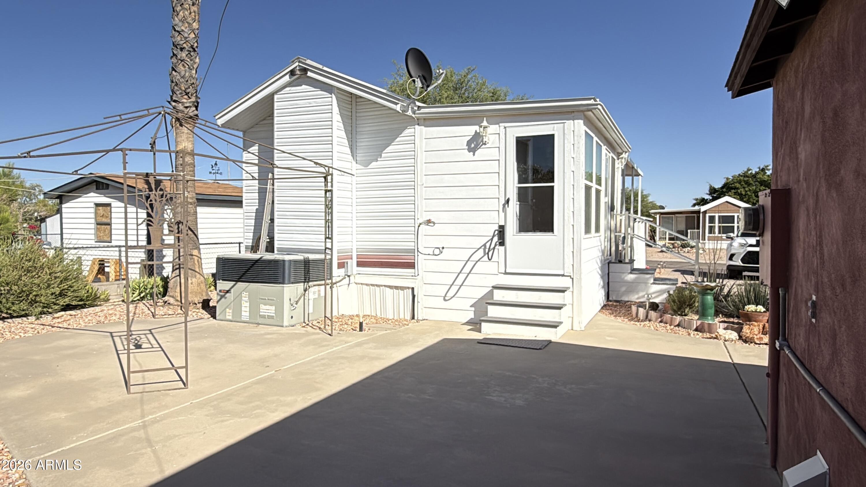 21340 Trading Post Trail Congress, AZ 85332 - Photo 28 of 31 a view of a patio with a table and chairs and potted plants