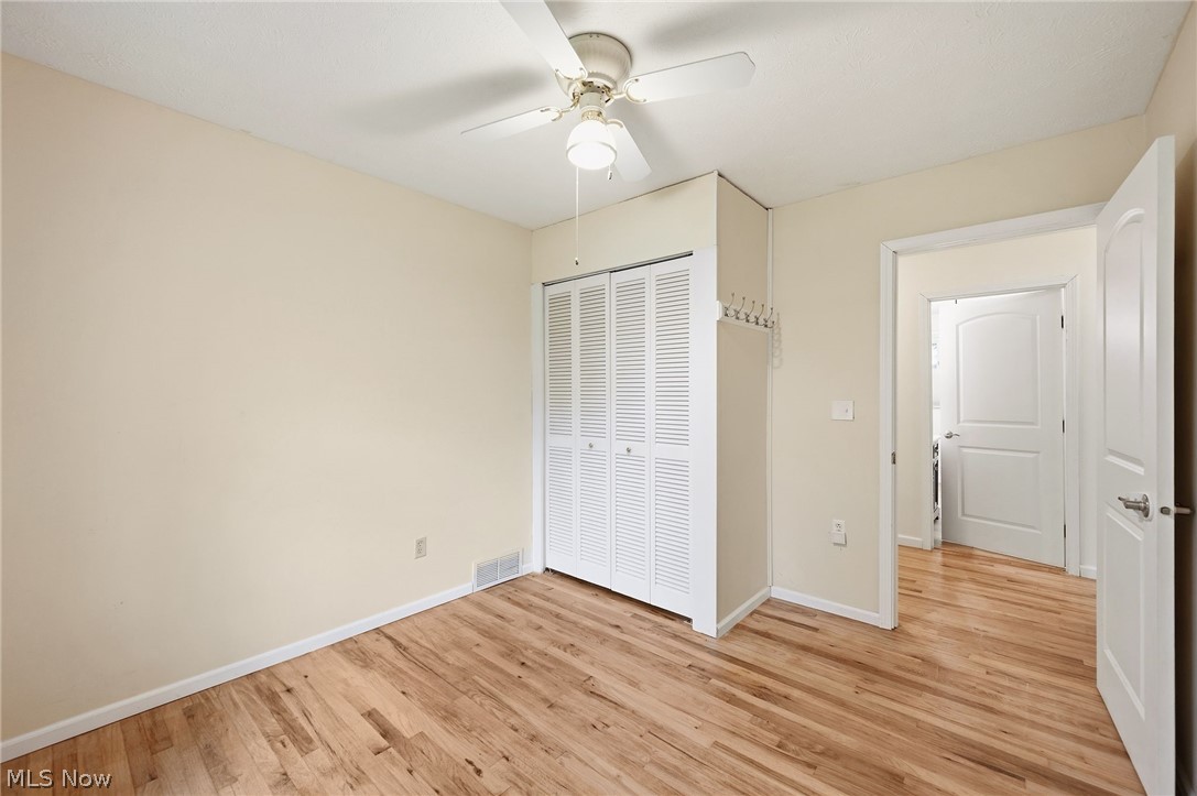 1515 Barlow Road Hudson, OH 44236 - Photo 15 of 31 Bedroom 2 with wood flooring, ceiling fan and natural light.