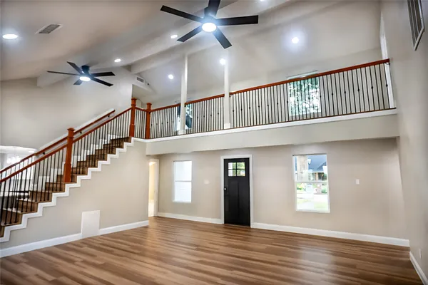 a view of an entryway with wooden floor