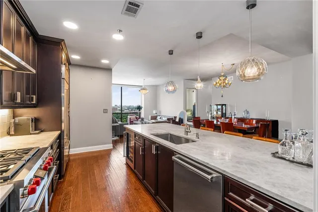 a kitchen with lots of counter top space and wooden floor
