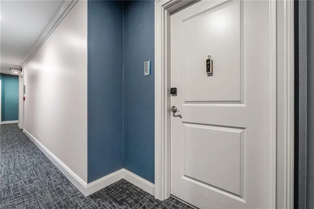 a view of a hallway with washer and dryer