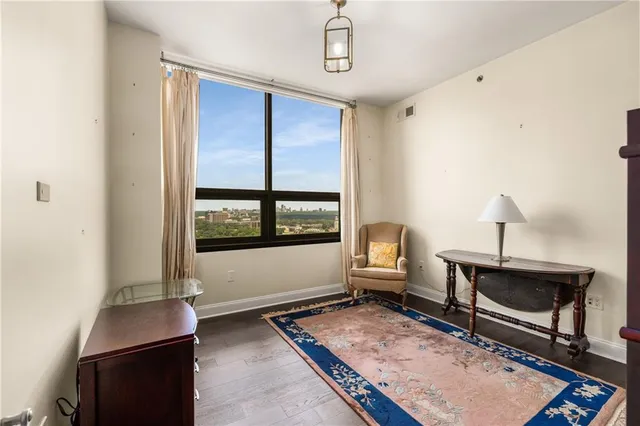 a living room with furniture fireplace and window