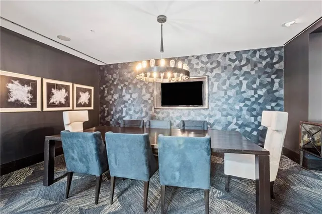 a view of a livingroom with furniture window and wooden floor