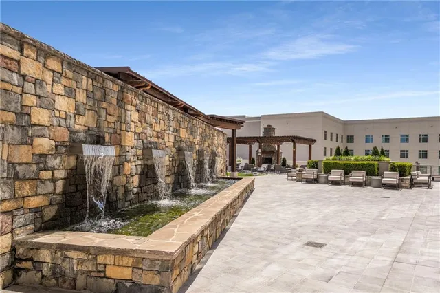 a view of a building with sitting area