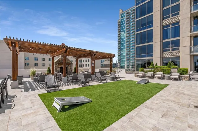 a view of a house with swimming pool and sitting area