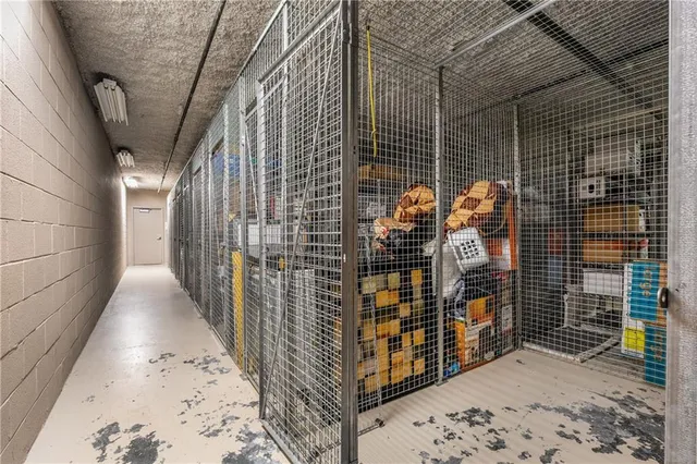 a view of water heater room with wooden floor