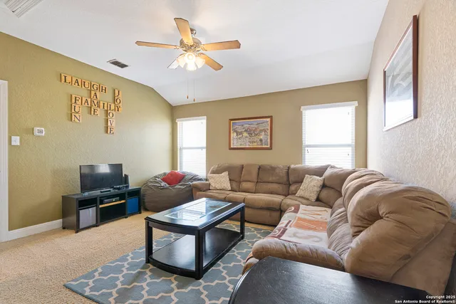 a living room with furniture and a window