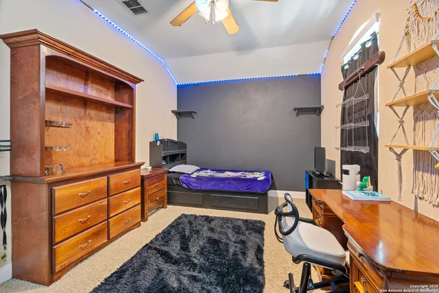 a bedroom with furniture and a bed