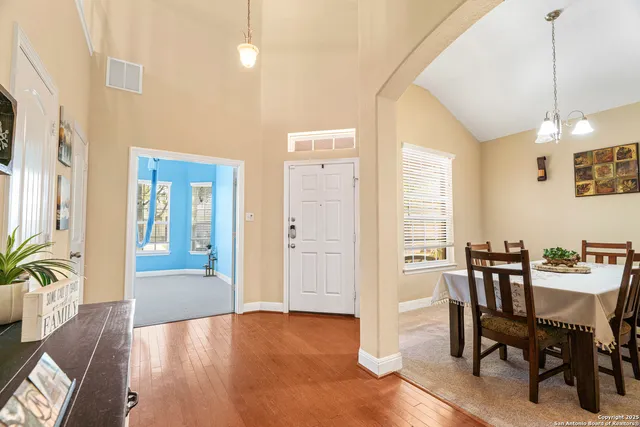 a view of a livingroom with furniture window and wooden floor
