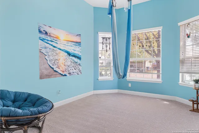 a bedroom with furniture and a window