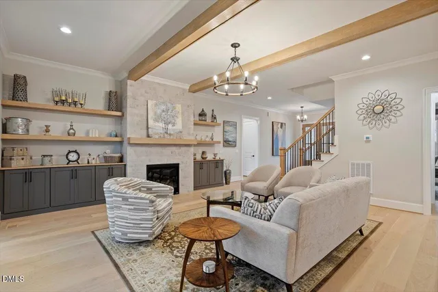 a kitchen with cabinets appliances and a wooden floor