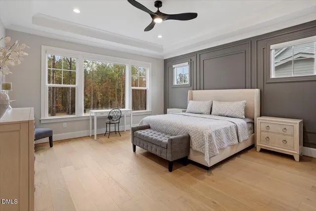 a spacious bedroom with a large bed and a window