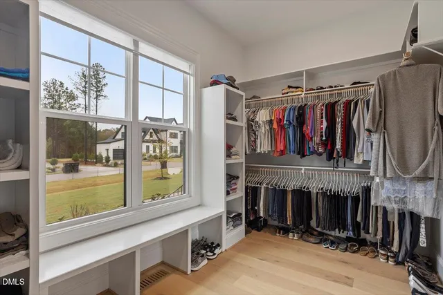a living room with furniture and a ceiling fan