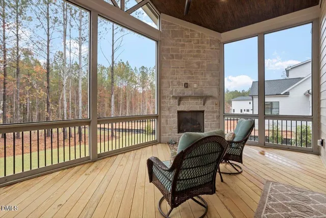 a view of a house with backyard and porch