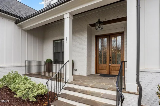 a view of a livingroom with furniture and a floor to ceiling window