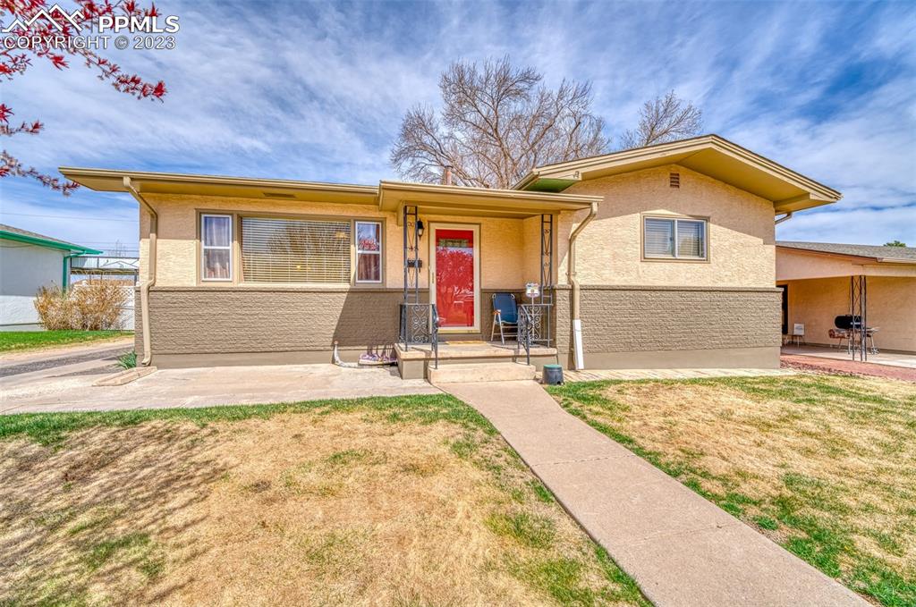 45 Duke Street Pueblo, CO 81005 - Photo 1 of 49 a front view of a house with a yard
