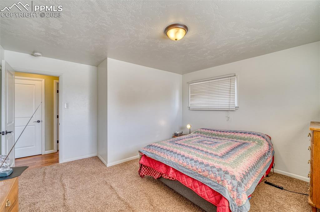 45 Duke Street Pueblo, CO 81005 - Photo 15 of 49 a bedroom with a bed and a window