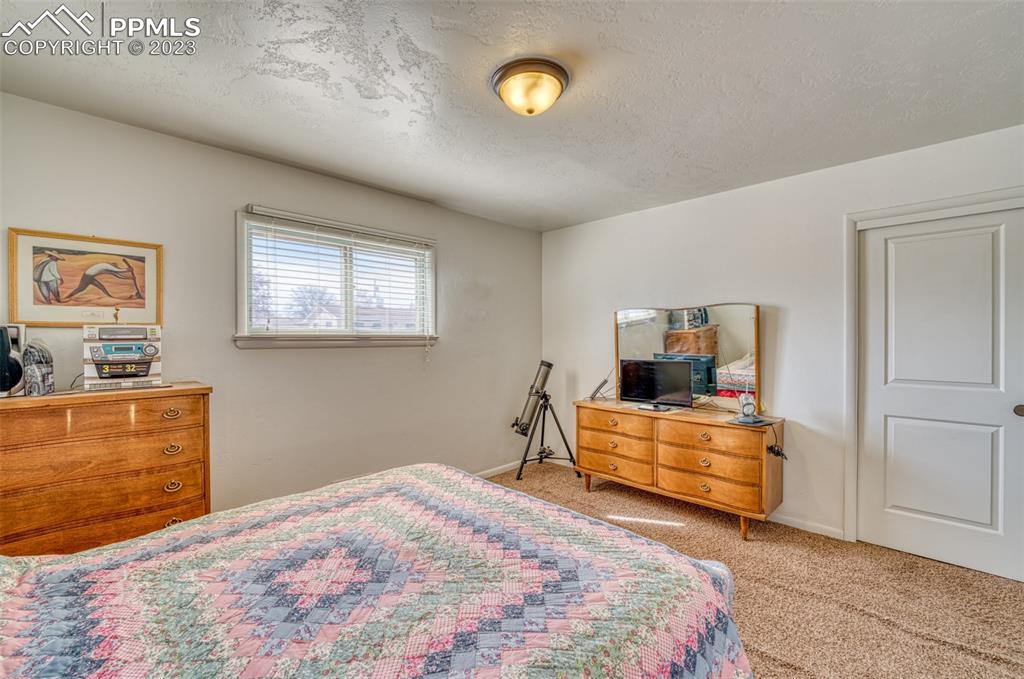 45 Duke Street Pueblo, CO 81005 - Photo 16 of 49 a bedroom with a bed and furniture