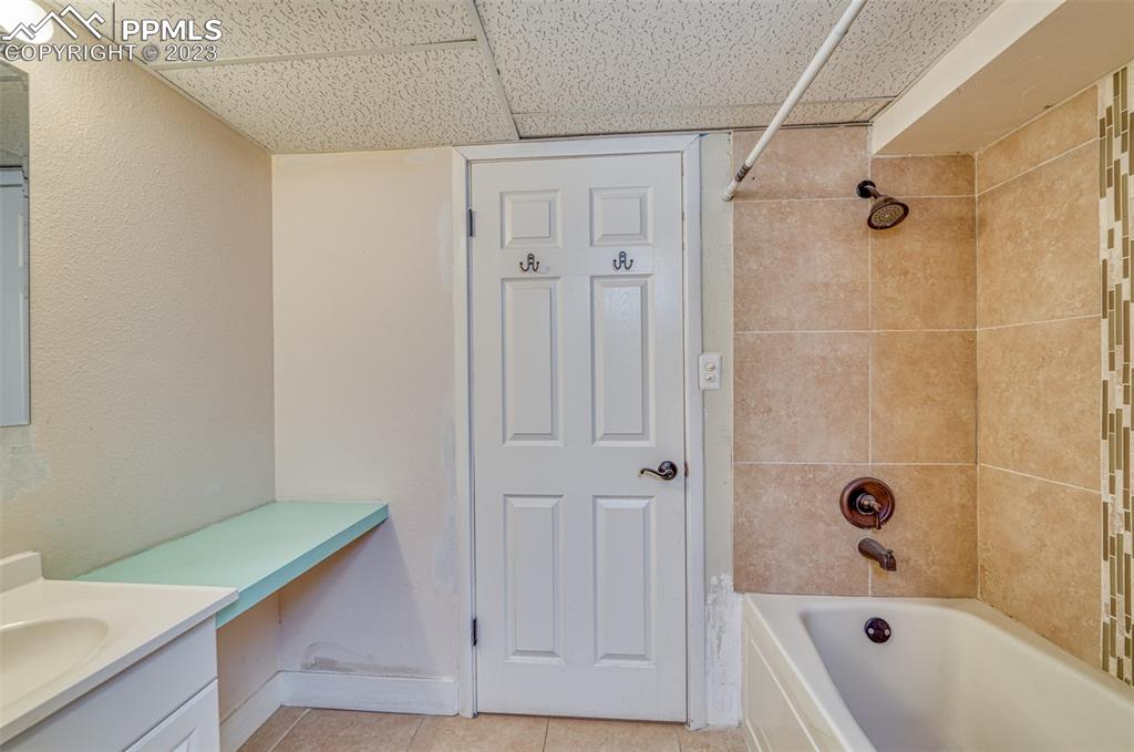 45 Duke Street Pueblo, CO 81005 - Photo 29 of 49 a bathroom with a bathtub and a shower