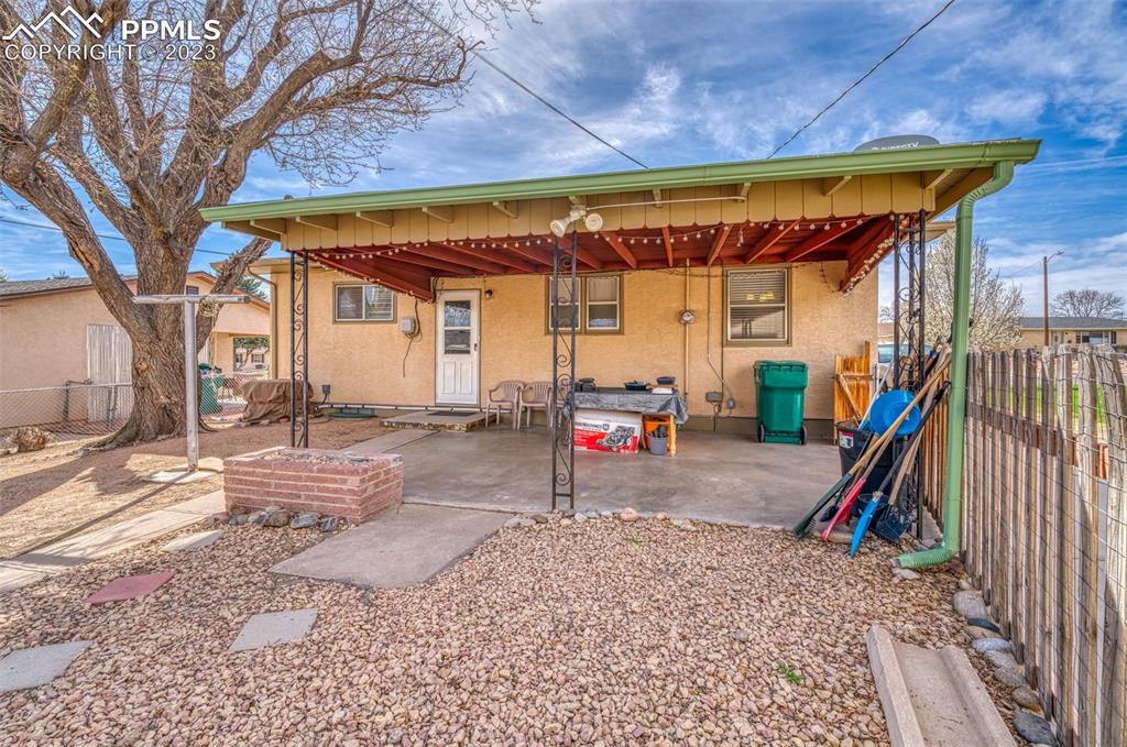 45 Duke Street Pueblo, CO 81005 - Photo 34 of 49 a view of a patio with a table and chairs