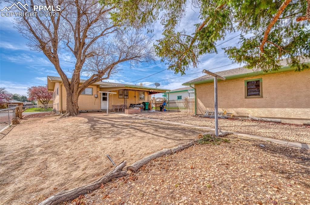 45 Duke Street Pueblo, CO 81005 - Photo 36 of 49 a backyard of a house with a table and chairs