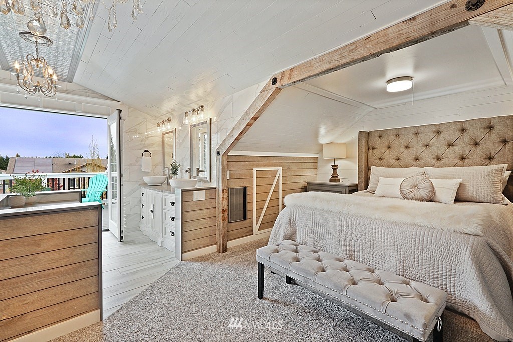 6601 Highland Drive Everett, WA 98203 - Photo 15 of 32 a bedroom with a bed and dresser with mirror