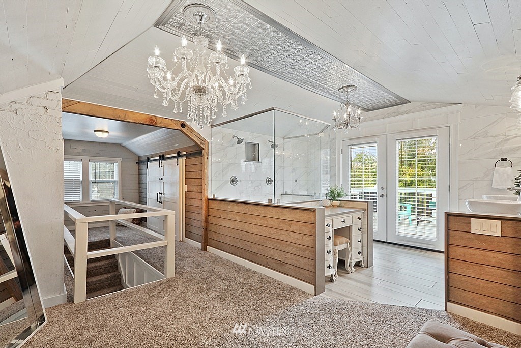 6601 Highland Drive Everett, WA 98203 - Photo 16 of 32 a view of hall way with furniture and chandelier