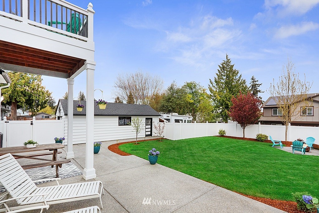 6601 Highland Drive Everett, WA 98203 - Photo 24 of 32 a view of a house with a swimming pool and a yard