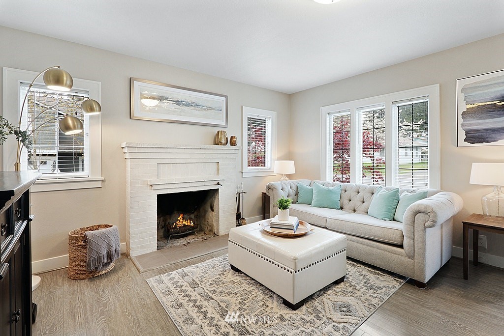 6601 Highland Drive Everett, WA 98203 - Photo 3 of 32 a living room with furniture a window and a fireplace