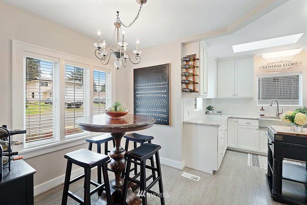 6601 Highland Drive Everett, WA 98203 - Photo 9 of 32 a view of a dining room with furniture window and outside view
