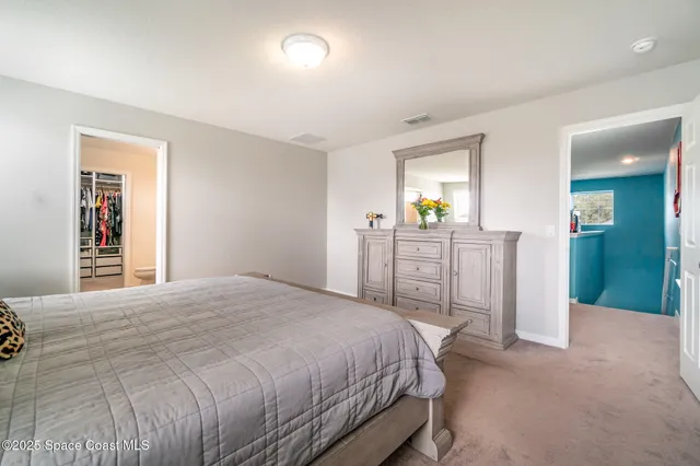 a bedroom with a bed and a cabinets
