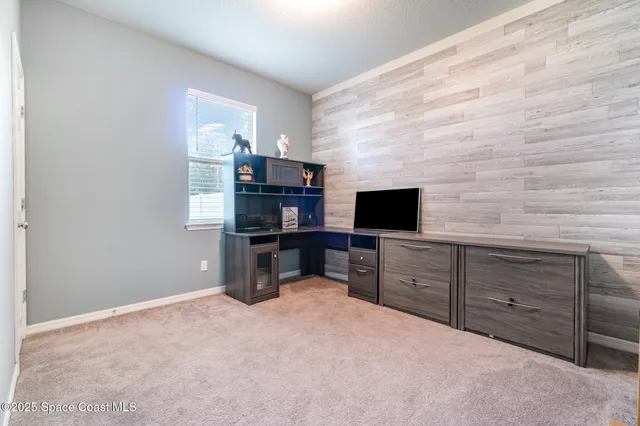 a bedroom with a bed and furniture