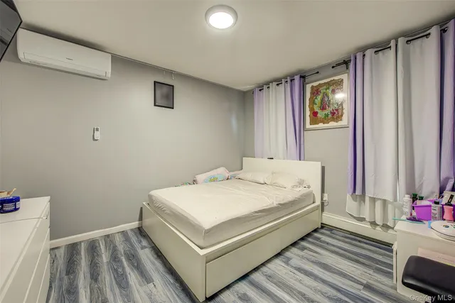 a room with a bed and a window