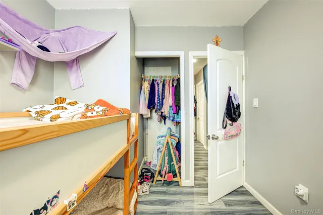 a bathroom with a toilet sink vanity granite and shower