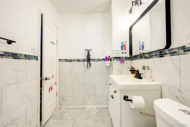 a view of staircase with white walls and a window