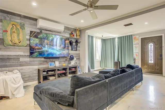 a living room with furniture and window